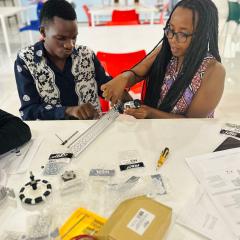 Rwandan students building a robot